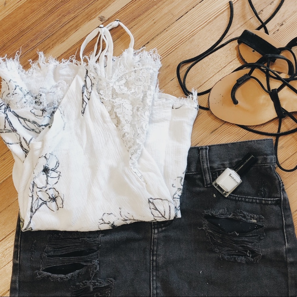 Flowy floral tank top with distressed lace inset